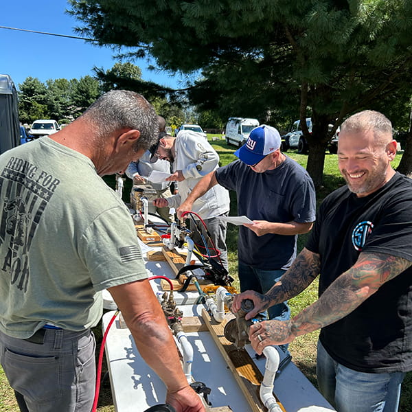 Professional completing backflow recertification course to renew backflow prevention certification