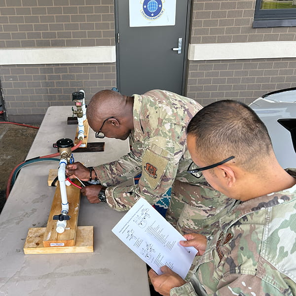 Veteran instructor providing on-site backflow certification training at your company’s location or at military bases for certified backflow testers